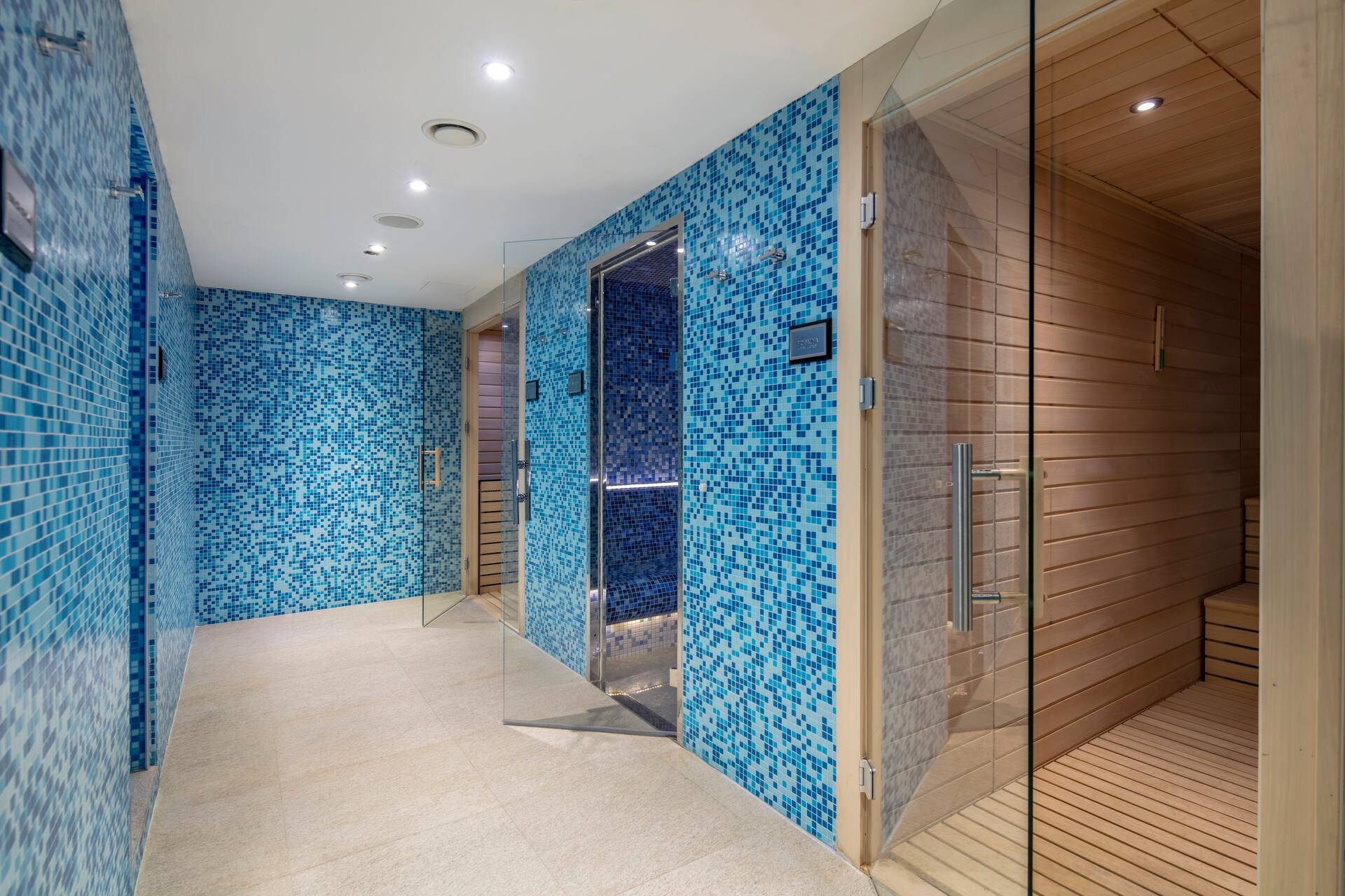 Blue-tiled steam room and sauna at Doclea Spa